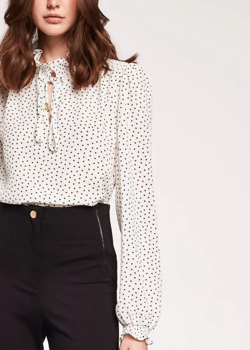 Blusa con maniche a sbuffo